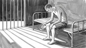 Ilustración en blanco y negro de un hombre descalzo sentado en una cama de metal dentro de una celda con barrotes, que sostiene un cuenco vacío.