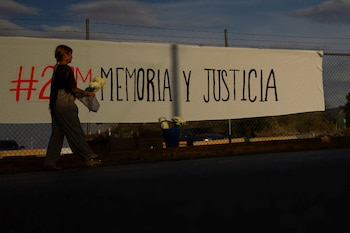 A woman holds flowers as