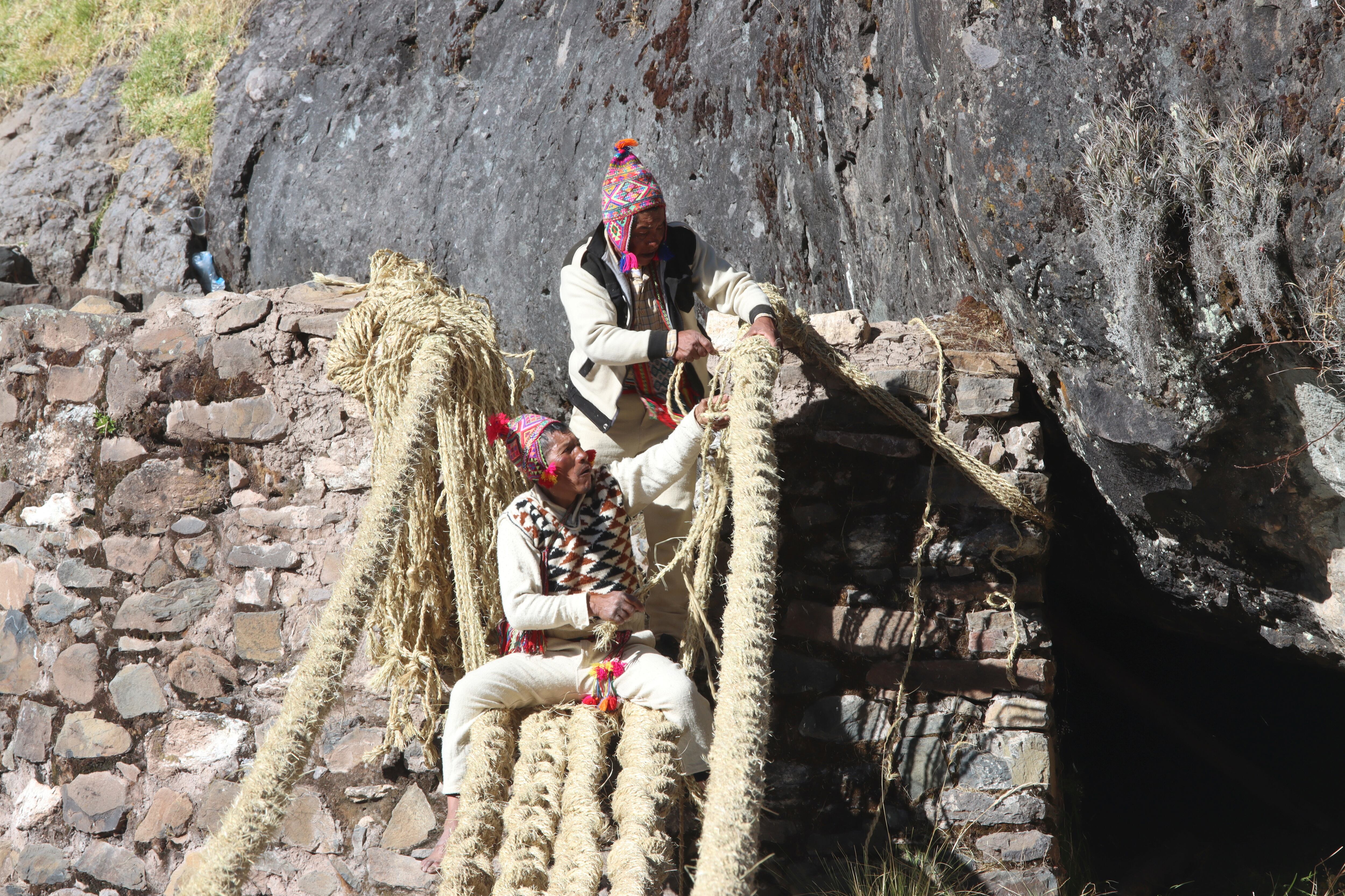 Members of the Huinchiri community rebuild an Incan hanging bridge, known as the Qeswachaka bridge, using traditional weaving techniques in Canas, Peru, June 13, 2021. Picture taken June 13, 2021. Cusco Regional Government/Handout via REUTERS ATTENTION EDITORS - THIS IMAGE HAS BEEN SUPPLIED BY A THIRD PARTY. NO RESALES. NO ARCHIVES