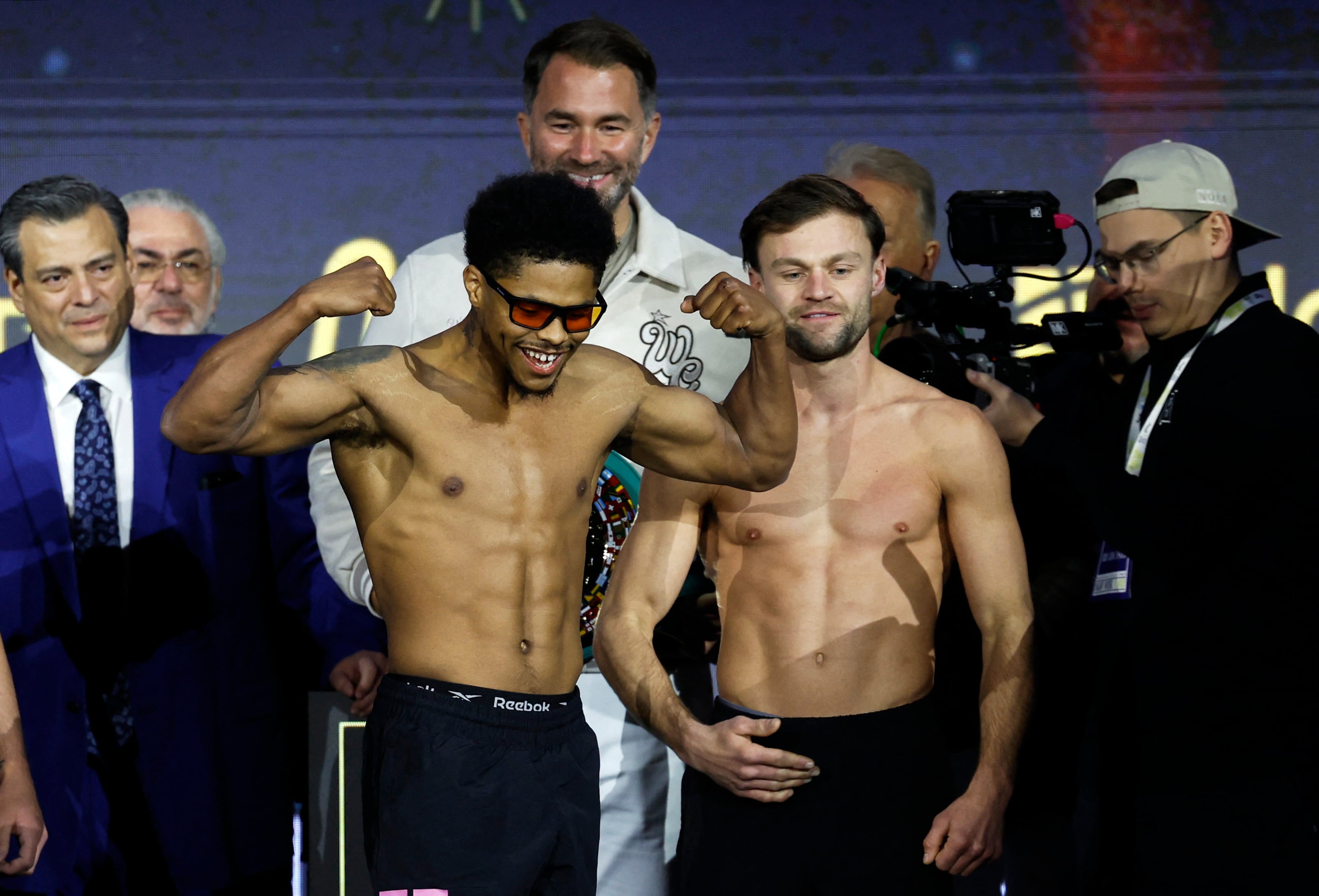 Boxing - Light Heavy Championship - Artur Beterbiev v Dmitrii Bivol - Weigh-In - Boulevard City, Riyadh, Saudi Arabia - February 21, 2025 Shakur Stevenson and Josh Padley during the Weigh-In as promoter Eddie Hearn looks on REUTERS/Hamad I Mohammed