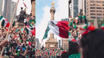 Gran multitud de personas ondea banderas de México alrededor del monumento del Ángel de la Independencia en un día soleado, con edificios altos al fondo.