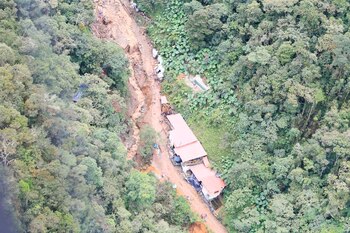 An aerial view taken from an overflight by Antioquia Governor Anibal Gaviria of the area affected by a flash flood that flooded a gold mine and left at least 10 dead, in Abriaqui, Colombia April 7, 2022. Courtesy of Goverment of Antioquia/Handout via REUTERS ATTENTION EDITORS - THIS IMAGE WAS PROVIDED BY A THIRD PARTY. MANDATORY CREDIT