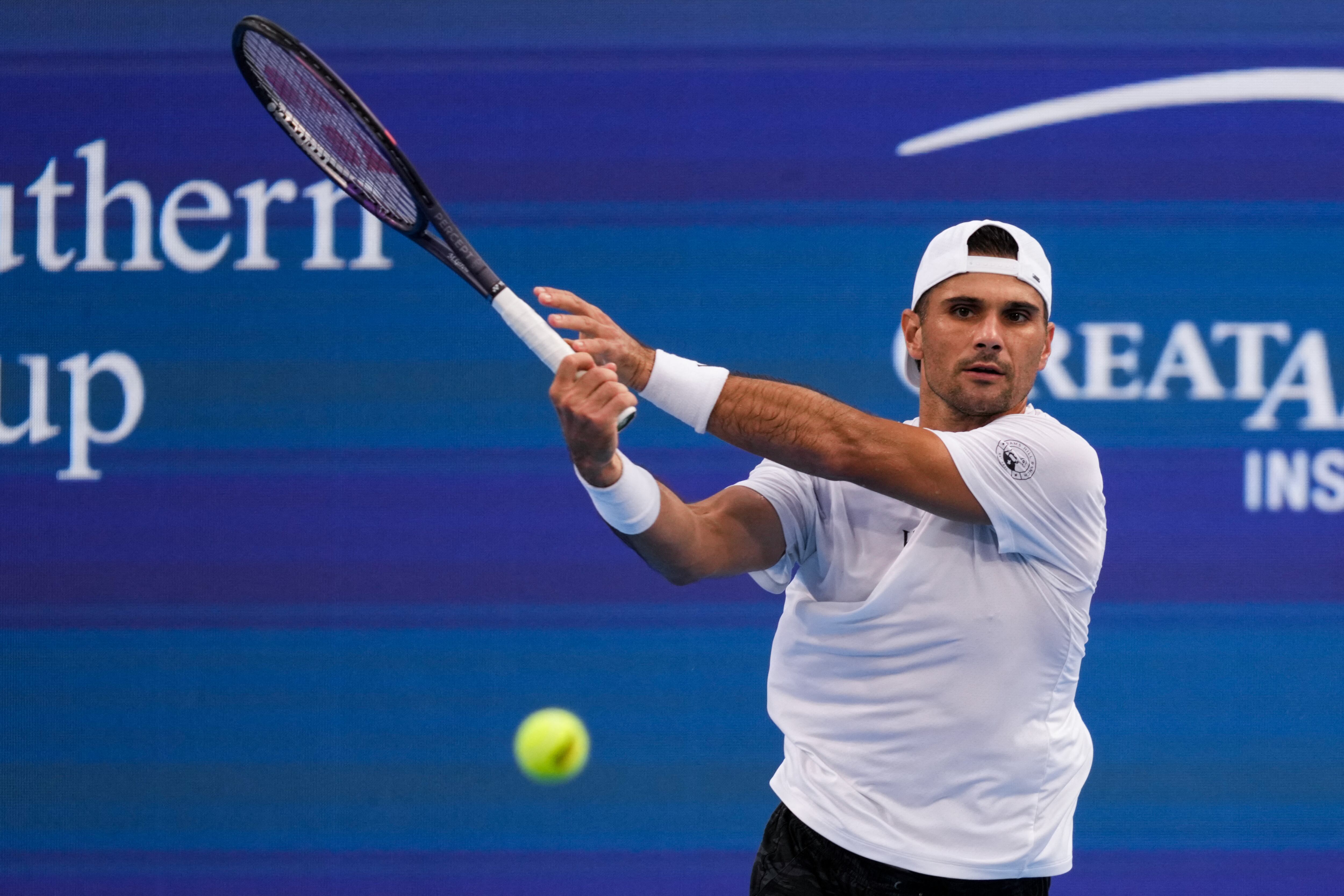 Aug 12, 2026; Mason, OH, USA; Marcos Giron (USA) returns a shot against Henrique Rocha (POR) during the Cincinnati Open at Lindner Family Tennis Center. Mandatory Credit: Aaron Doster-Imagn Images