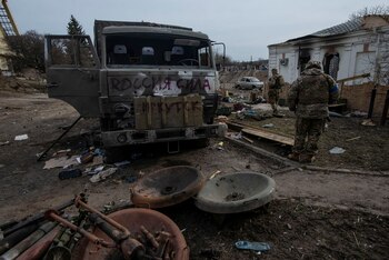 Ukrainian service members stand next