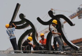 Chinese workers put the finishing