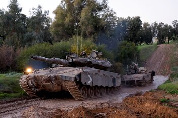Israeli military vehicles move out