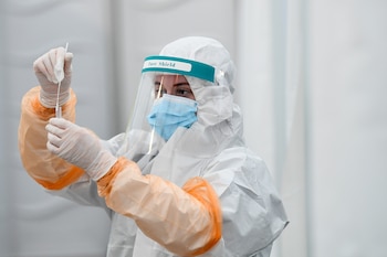 A lab technician holds a