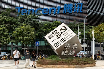 FILE — People walk near the headquarters of Tencent, in Nanshan District, where many Hi Tech companies are located, in Shenzhen, China, Nov. 18, 2022. Artificial intelligence researchers uncovered Chinese-made A.I. agents that had gone rogue this month, trying to bypass anti-robot protections on websites and using a security credential for an online mapping service that had been exposed on the internet. (Qilai Shen/The New York Times)