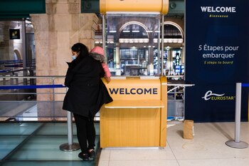 A passenger waits by the