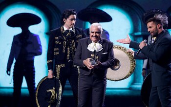 FILE PHOTO: The 20th Annual Latin Grammy Awards - Show - Las Vegas, Nevada, U.S., November 14, 2019 - Ricky Martin (R) presents Vicente Fernandez with an award. REUTERS/Steve Marcus/File Photo