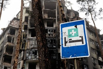View of a damaged building with a hospital sign in the foreground as Red Cross staff (not pictured) deliver food and first aid to residents that have been affected by fighting during Russia's invasion of Ukraine, in Irpin, April 1, 2022. Picture taken April 1, 2022. International Committee of the Red Cross/Handout via REUTERS THIS IMAGE HAS BEEN SUPPLIED BY A THIRD PARTY. NO RESALES. NO ARCHIVES. MANDATORY CREDIT