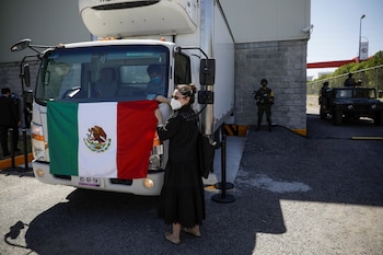 A woman hangs a Mexico's