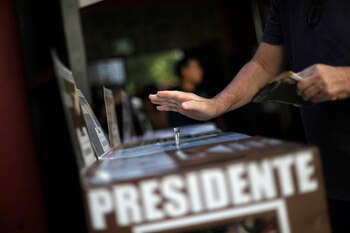 A voter casts his ballot