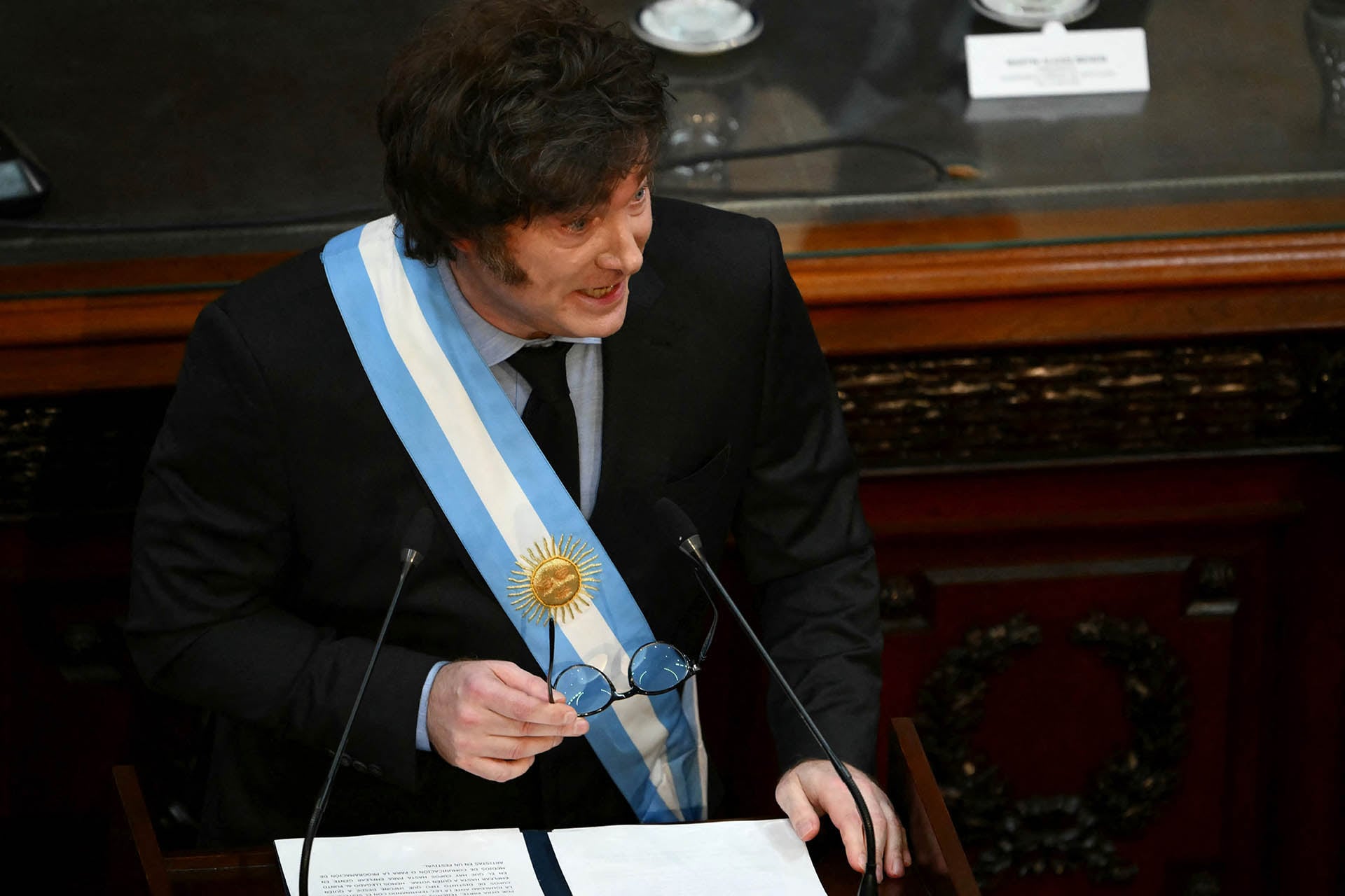 Argentina's President Javier Milei gestures as he speaks during the inauguration of the 143rd ordinary session of Congress at the National Congress in Buenos Aires on March 1, 2025. (Photo by Luis ROBAYO / AFP)