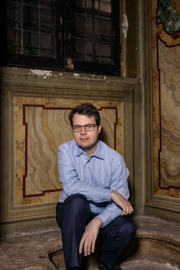 Christopher Olah, one of Anthropic’s co-founders, who leads the team responsible for understanding why artificial intelligence systems like the company’s Claude act the way they do, at the Lancisiana Library in Rome, May 26, 2026. In private meetings, Anthropic consulted religious scholars to help instill morality into its AI models — and make the case that Claude could be conscious. (Alessandro Penso/The New York Times)
