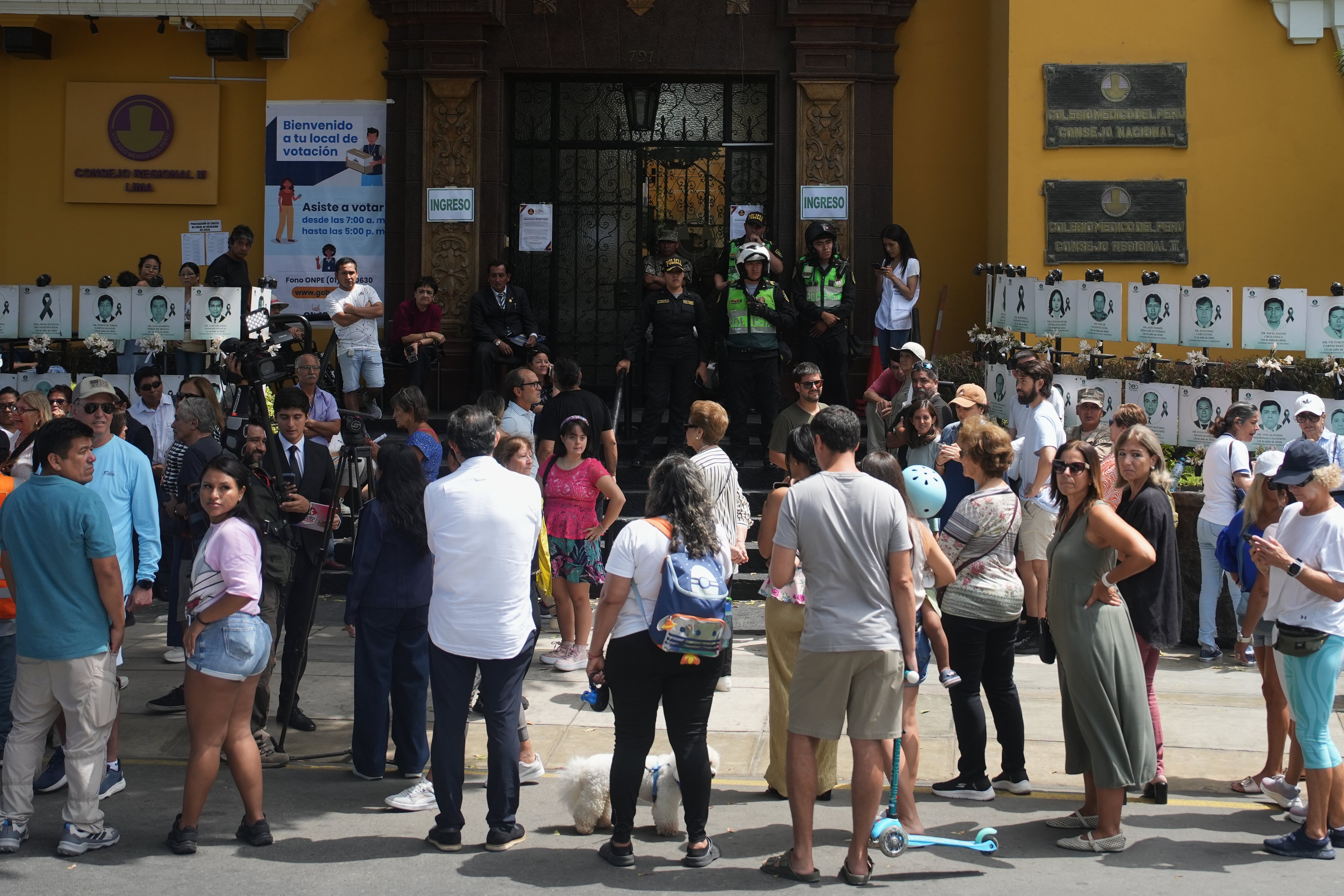 Voters wait outside a polling station as its opening is delayed during general elections in Lima, Peru, on Sunday, April 12, 2026.(AP Photo/Guadalupe Pardo)