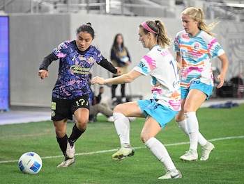 Oct 16, 2024; San Diego, CA, USA; Club America midfielder Natalia Mauleon (17) fights for the ball with San Diego Wave FC forward Makenzy Doniak (15) and Kristen McNabb (14) at Snapdragon Stadium. Mandatory Credit: Denis Poroy-Imagn Images