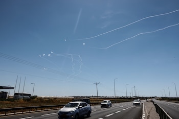 Cars drive on a main