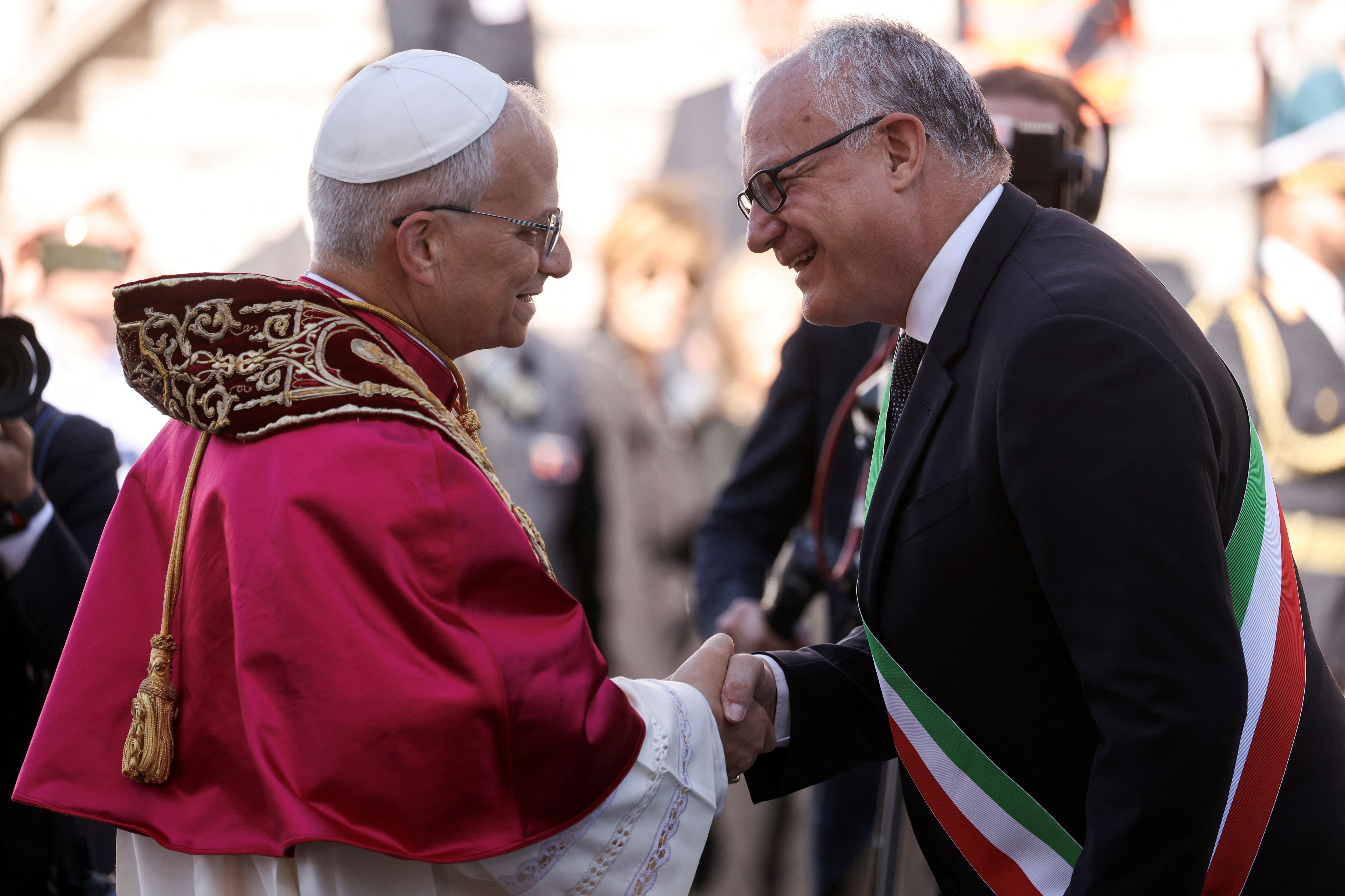 Pope Leo XIV shakes hands with Rome