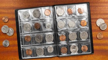 Álbum de monedas. (FREEPIK)