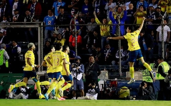 Soccer Football - Liga MX - Semi Finals - Second Leg - Cruz Azul v America - Estadio Ciudad de los Deportes, Mexico City, Mexico - December 8, 2024 America's Ramon Juarez celebrates scoring their third goal with teammates REUTERS/Henry Romero