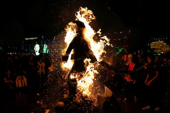 Demonstrators burn an effigy depicting a member of the army during a protest to demand justice in the 2014 disappearance of 43 student teachers from the Ayotzinapa Rural Teachers' College, in Mexico City, Mexico September 26, 2024. REUTERS/Raquel Cunha