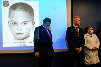 Capt. Jason Smith of the Philadelphia police, center, with William C. Fleisher of the Vidocq Society, a forensic investigative group, and the Philadelphia medical examiner, Dr. Constance DiAngelo, at a news conference on Thursday where the authorities identified a boy found dead in a cardboard box in 1957.