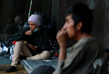 Homeless people are pictured on the sidewalk after Mexico's government declared a health emergency on Monday and issued stricter rules against the fast-spreading coronavirus disease (COVID-19), in Mexico City, Mexico, April 2, 2020. Picture taken April 2, 2020. REUTERS/Henry Romero