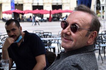 Actor Kevin Spacey sits at
