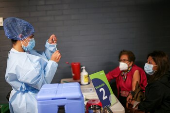 A healthcare worker prepares a