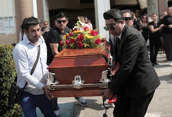 Friends and family members carry