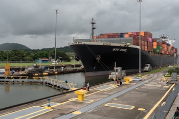 A container ship navigates through the Miraflores locks of the Panama Canal near Panama City, Panama, in November 2023. Photographer: Walter Hurtado/Bloomberg