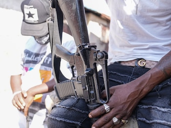 A member of the ''Vivre Ensemble'' (''Lve Together'') gang shows off his rifle in Port-au-Prince, the capital of Haiti, in the neighborhoods of La Saline and Bel Air, territories controlled by the “Vivre Ensemble” (''Live Together'') gang, where families continue to live. Regular clashes with law enforcement cause significant damage and casualties: in 2025, 6,000 people are believed to have lost their lives in the civil war raging in this Caribbean country.