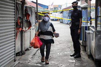 A police officer stands guard