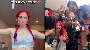 Una mujer de cabello rojo con trenzas, un arete de cruz y un tatuaje. La mujer está con cinco personas, ropa, una cinta métrica y un perro.