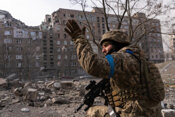 A Ukrainian serviceman guards his