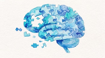 Ilustración de un cerebro compuesto por piezas de rompecabezas en tonos azules y celestes, con algunas piezas sueltas, sobre papel blanco texturizado.