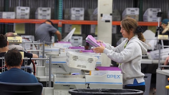 Election ballots are processed under tight security at the Orange County Registar of Voters, in Santa Ana, Calfornia .
