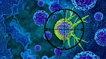 Estructuras esféricas microscópicas de color azul y una de color verde centrada dentro de una mira telescópica negra.