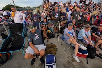 Spectators wait for the launch