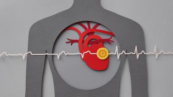 Paper craft illustration of human chest with heart and pacemaker.