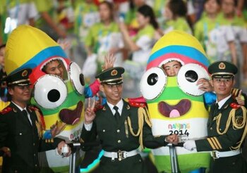 NANJING, CHINA - AUGUST 28: Chinese policemen pose for photos with mascots after the closing ceremony for the Nanjing 2014 Summer Youth Olympic Games at the Nanjing Olympic Sports Centre on August 28, 2014 in Nanjing, China. (Photo by Feng Li/Getty Images)