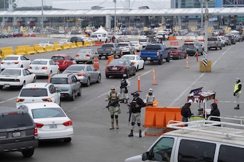 Mexican federal forces stand watch