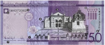 Reverso de un billete de 50 pesos dominicanos en tonos púrpura, mostrando la fachada de la Catedral Primada de América y elementos de seguridad