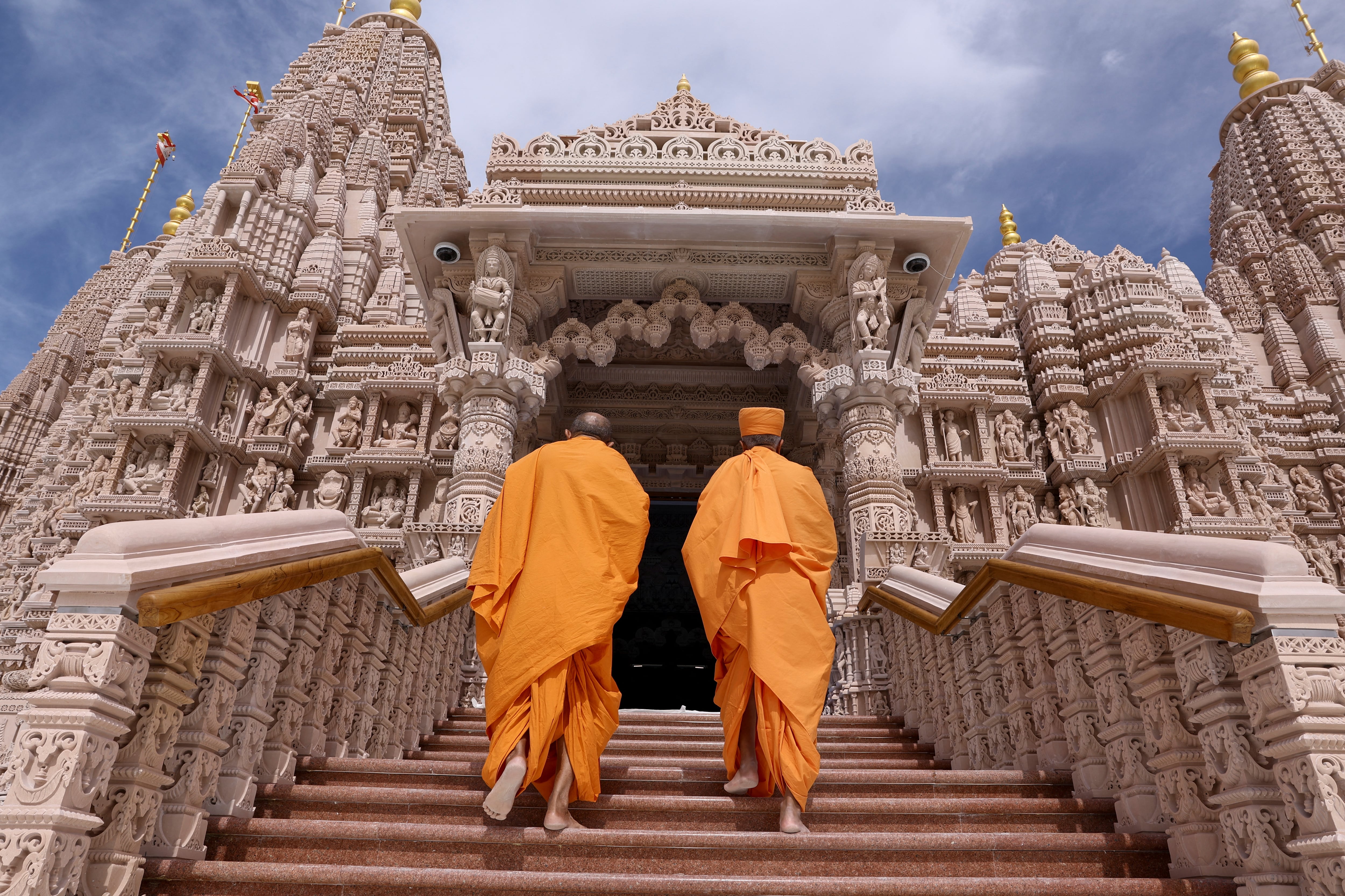 Monks walk at the BAPS Hindu Mandir temple, in Abu Dhabi, United Arab Emirates, February 7, 2024. REUTERS/Amr Alfiky