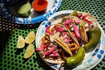 NYTSELECTS — Tacos as El Chile Toreado in Santa Fe, N.M., Aug. 5, 2026. Santa Fe is not short on pork preparations, but the carnitas, adobada and al pastor coming out of this unassuming food truck are particularly noteworthy. (Gabriela Campos/The New York Times)