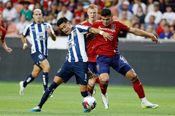 Jul 26, 2023; Sandy, UT, USA; Monterrey midfielder Maxi Meza (11) and Real Salt Lake defender Brayan Vera (4) battle in the first half at America First Field. Mandatory Credit: Jeff Swinger-USA TODAY Sports