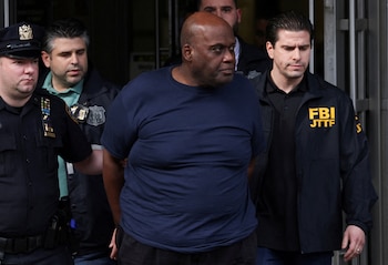 Frank James, the suspect in the Brooklyn subway shooting walks outside a police precinct in New York City, New York, U.S., April 13, 2022. REUTERS/Andrew Kelly TPX IMAGES OF THE DAY