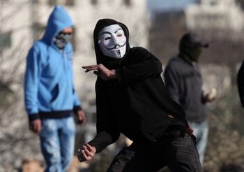 A Palestinian stone thrower wearing