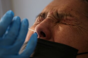 A healthcare worker takes a